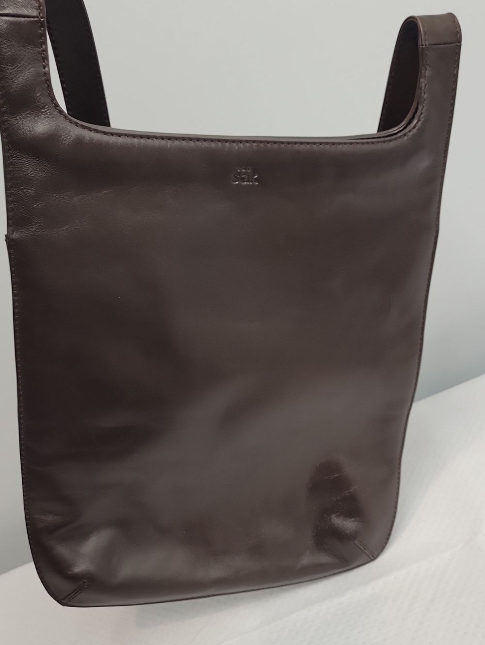 the sak flat slim brown leather shoulder bag